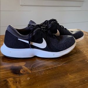 Nike Revolution 4 running shoes in used condition